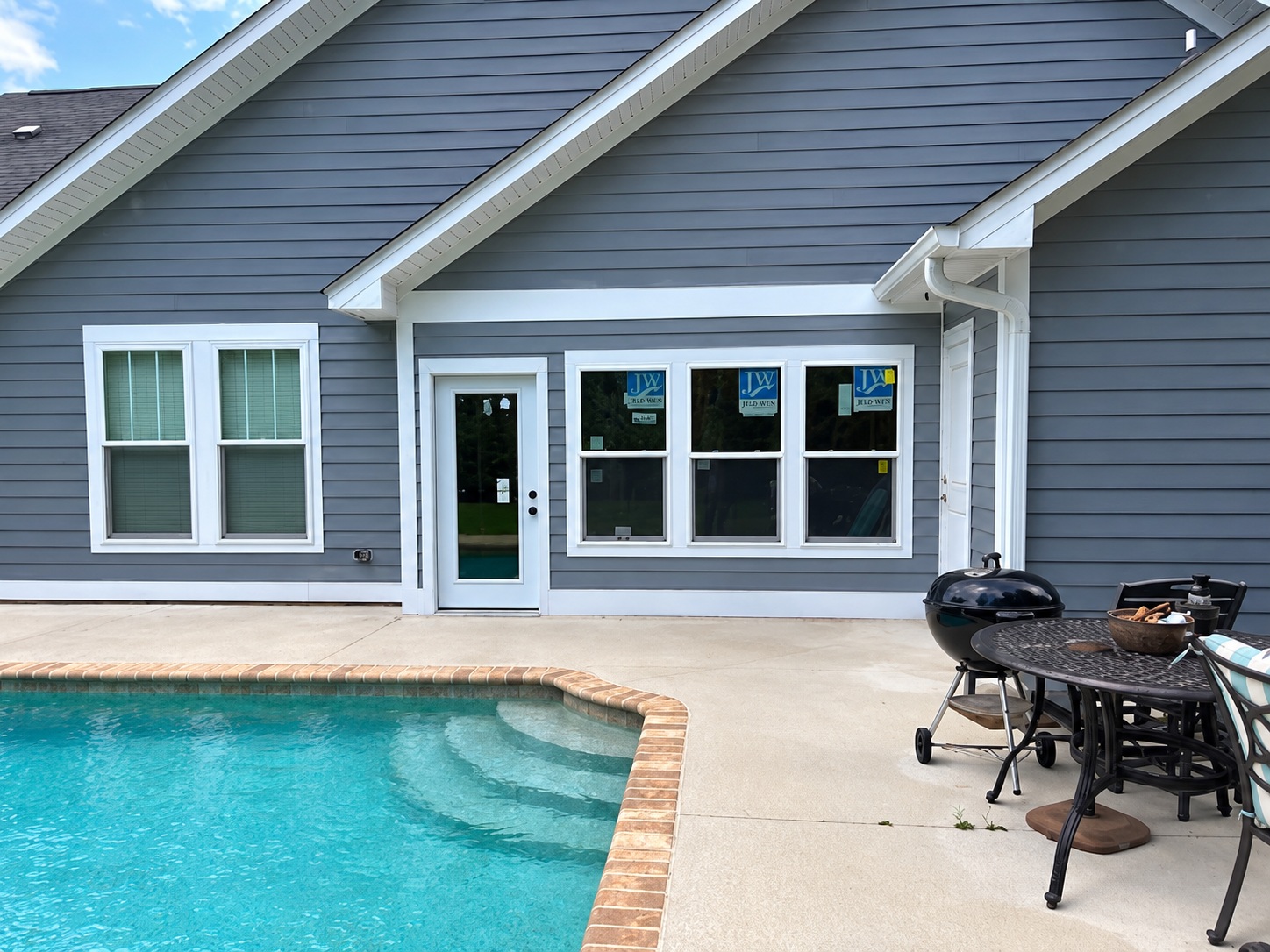 Poolside porch transformed into an enclosed sunroom